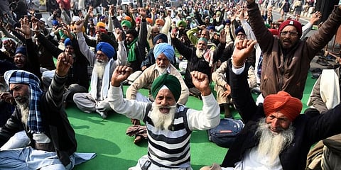 Farmers shout slogans during their protest against the new farm laws at Ghazipur Delhi-UP border in Ghaziabad Thursday. (Photo | Parveen Negi, EPS)