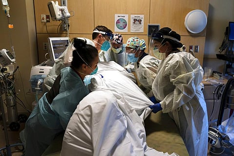 Across the U.S., the surge has swamped hospitals with patients and left nurses and other health care workers shorthanded and burned out. (Photo | AP)