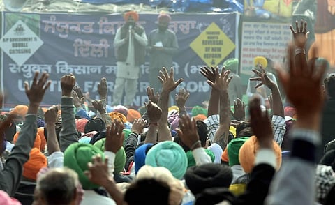 Farmers shout slogans at Singhu border during their 'Delhi Chalo' protest against the Centre's new farm laws in New Delhi Friday. (Photo | PTI)