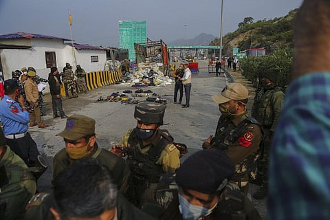 Indian security forces inspect the site after a gunfight between suspected rebels and Indian security forces at a checkpoint in Nagrota, outskirts of Jammu, India. (Photo | AP)