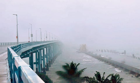 Dark clouds hover over Pamban Bridge at Rameswaram on Thursday