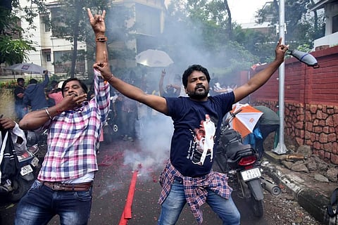 Fans celebrating the political entry of Rajnikanth outside his residence at Poes garden in Chennai on Thursday. (Photo | R Sathish Babu/EPS)