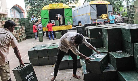 Workers arrange ballot boxes in Hyderabad. (Photo | Ashwin Prasath, EPS)
