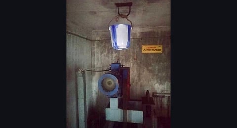 Buckets installed beneath the ceiling to prevent water leaking into the elevator. (Photo | Express)
