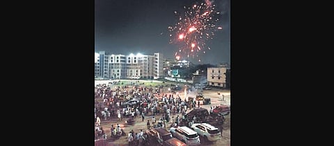 AIMIM workers celebrate the victory of its candidates in GHMC elections at the party headquarters in Hyderabad on Friday