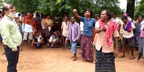 Agitated tribals explaining to an official why they don't want Christians to live in their area in Kondagaon district (Photo | Israr Ahmed)
