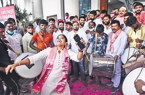 TRS workers celebrate the party’s lead in the GHMC polls at Telangana Bhavan on Friday | Vinay Madapu