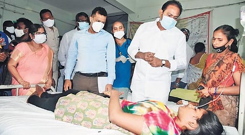 Deputy Chief Minister (Health) Alla Kali Krishna Srinivas (Nani) enquires about the condition of patients at GGH in Eluru on Saturday | Express