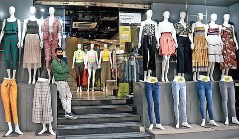A shopkeeper waits for customers at Sarojini Nagar Market; a deserted look of Connaught Place, by far the busiest place in the national capital on a regular day. (Photo | Shekhar Yadav, EPS)