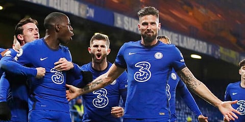 Chelsea's Kurt Zouma (SL) and Olivier Giroud (CR) celebrate with teammates after scoring their side's second goal against Leeds. (Photo | AP)