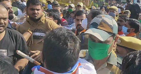 The youth brigades of BJP and Congress fight at BJP headquarters on Tuesday (Photo | EPS)