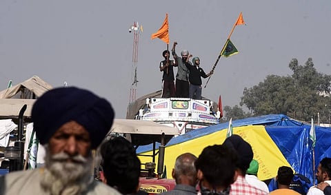 Farmers raise slogans at Singhu border during Delhi Chalo protest against the new farm laws in New Delhi Tuesday Dec. 8 2020. (Photo | Parveen Negi/EPS)