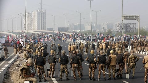 Security personnel stand guard as farmers block the Delhi-Meerut Expressway. (Photo | Shekhar Yadav/EPS)