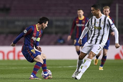 Barcelona's Argentinian forward Lionel Messi (L) challenges Juventus' Portuguese forward Cristiano Ronaldo. (Photo | AFP)
