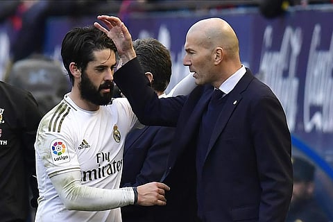 Real Madrid's Isco, left, talks with Real Madrid's head coach Zinedine Zidane. (Photo | AFP)