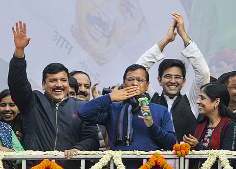 Delhi CM and AAP convenor Arvind Kejriwal (C) gestures during his address to supporters after party's victory in the State Assembly polls, at AAP office in New Delhi. (Photo | PTI)