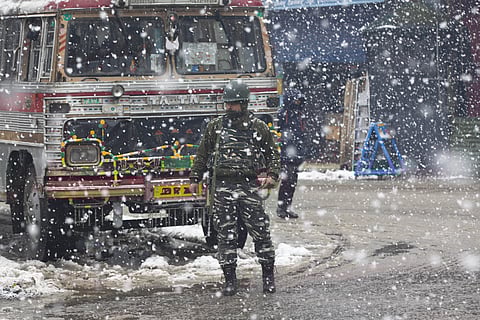 An Indian paramilitary soldier stands guard as snow falls in Srinagar, Indian controlled Kashmir, Wednesday, Jan. 15, 2020. (Photo | AP)