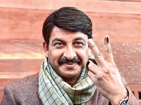 Manoj Tiwari, who led the BJP’s campaign, flashes the victory sign on Monday | Pti