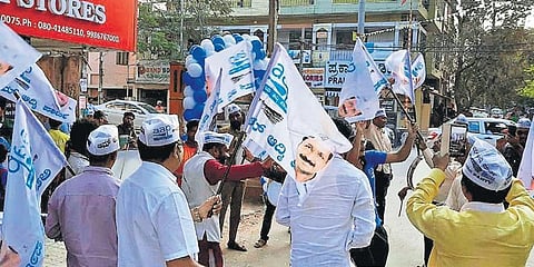 AAP workers celebrate the party’s Delhi assembly poll victory, in Bengaluru on Tuesday. (Photo | EPS)