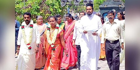 Fr S V Mathew Thuvayoor and other church officials accompany the bride and groom to the reception at the St Mary’s Orthodox Church hall in Adoor on Monday| Express