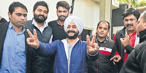Newly-elected AAP MLA Jarnail Singh dances as he arrives for a meeting at the residence of party chief Arvind Kejriwal, in Delhi on Wednesday.(Photo | Parveen Negi, EPS)