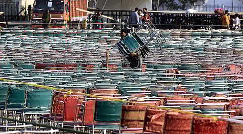 Workers arrange chairs as they prepare Ramlila Maidan for the oath-taking ceremony of Aam Aadmi Party (AAP) government in New Delhi on Friday Feb. 14 2020. (Photo | Parveen Negi/EPS)