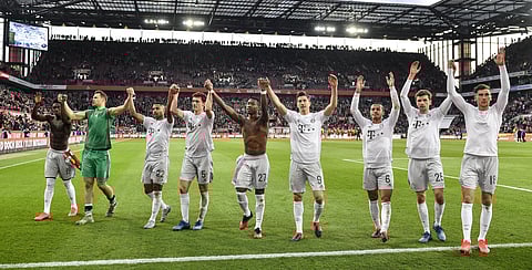 Bayern's players celebrate with supporters after winning the German Bundesliga soccer match between 1. FC Cologne and Bayern Munich in Cologne, Germany, Sunday, Feb. 16, 2020. (Photo | AP)