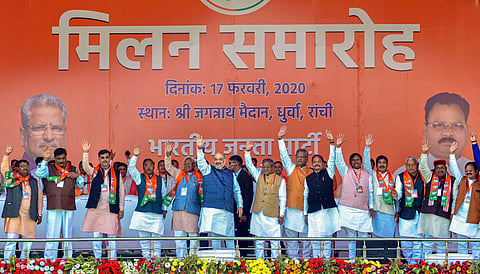 Union Minister Amit Shah (C) with former Jharkhand chief ministers Raghubar Das, Babulal Marandi and others wave during the merger of Jharkhand Vikas Morcha with the BJP at an event in Ranchi Monday Feb. 17 2020. (Photo | PTI)