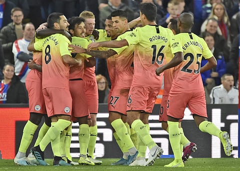 Manchester City players celebrate a goal during a match. (File Photo | AP)
