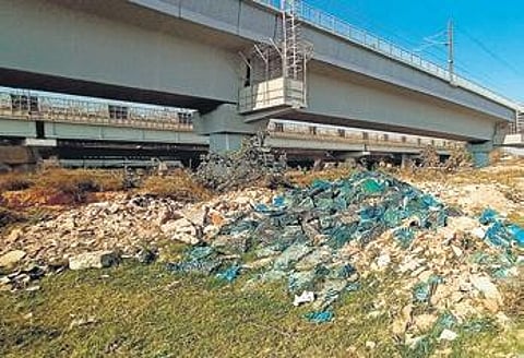 Pile of garbage underneath the bridge.