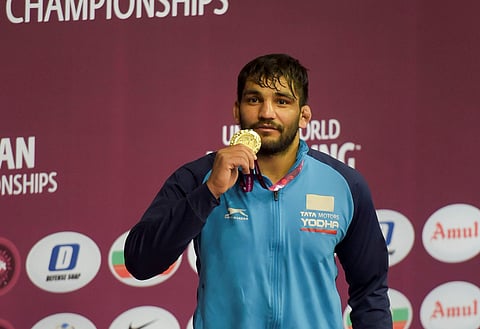 India's Sunil Kumar holds a gold medal after his win against Salidinov Azat KAZ in the final of Greco-Roman 87kg category wrestling match during the Asian Wrestling Championship 2020 in New Delhi Tuesday Feb. 18 2020. (Photo | PTI)