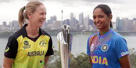 Cricket captains Meg Lanning of Australia, left, and Harmanpreet Kaur of India pose for a photo with the trophy ahead of the Women's T20 World Cup in Sydney. (Photo | AP)