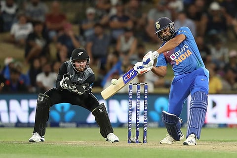 Rohit Sharma (R) bats watched by New Zealand’s Tim Seifert (L) during the fifth Twenty20 cricket match. (Photo | AFP)