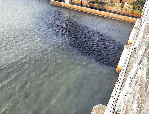 The black Periyar water under Pathalam bridge