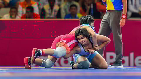 India's Divya Kakran (Blue) during her 68 kg freestyle wrestling match. (Photo | PTI)