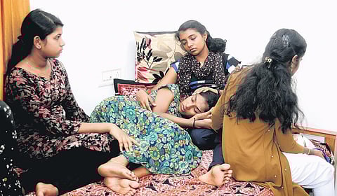 Devika Gireesh being consoled by her friends at her home in Perumbavoor | A Sanesh
