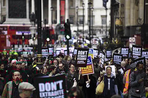 Demonstrators march to protest against the extradition of Wikileaks founder Julian Assange, in London, Saturday, Feb. 22, 2020. (Photo | AP)