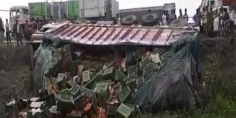 The truck, which was coming from the other side, lies overturned. (Photo| ANI)