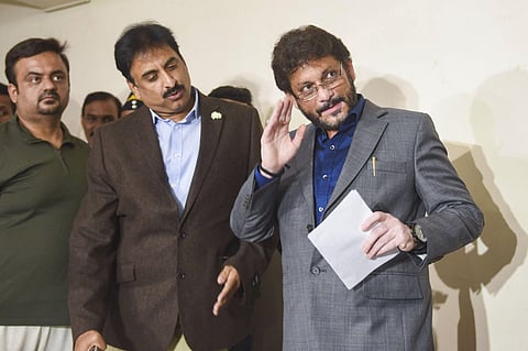AIMIM leader Waris Pathan reads his statement at a press conference in Mumbai Saturday Feb. 22 2020. (Photo | PTI)