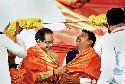 Maharashtra CM Uddhav Thackeray with his predecessor Devendra Fadnavis in Mumbai. (File Photo| PTI)
