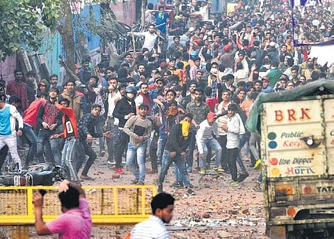 Rival groups hurl stones at each other after contrasting protests over the CAA turned violent at Maujpur in New Delhi on Sunday | Express
