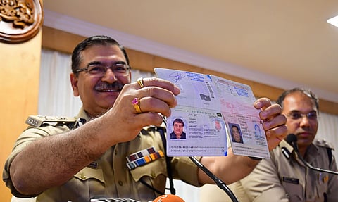 ADGP Amar Kumar Pandey displays multiple passports of Ravi Pujari on Monday. (Photo | Shriram B N, EPS)