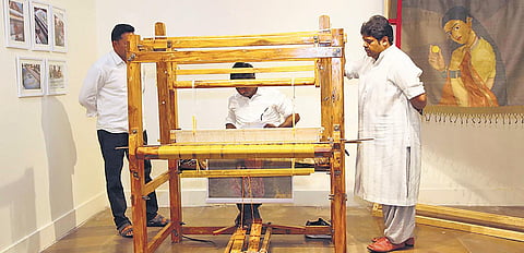 Gaurang Shah with a weaver(left, Lavina Baldota against Jean-Francois Lesage installation