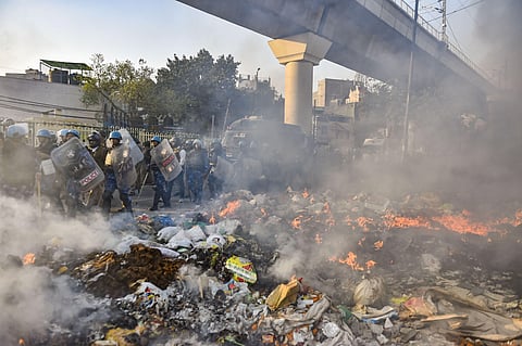 RAF personnel conduct flag march during clashes between those against and those supporting the Citizenship Amendment Act in Delhi Tuesday. (Photo | PTI)