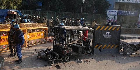 Burned vehicles lie at Chand Bagh area after violence over CAA protests in north-east Delhi on Tuesday. (Photo| Shekhar Yadav, EPS)
