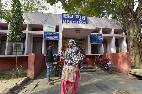 Tahira Begum from Mustafabad waits outside the mortuary of GTB hospital to receive the body of her sister Mehtab (22) who was killed during communal violence in northeast Delhi area over the amended citizenship law in New Delhi Thursday Feb 27 2020. (Phot