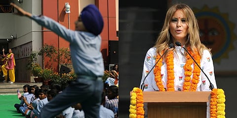 US First Lady Melania Trump, background, cheers as a boy dances impromptu while sitting with other children in the lawn at Sarvodaya Co-Educational Senior Secondary School in New Delhi. (Photo | AP)