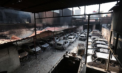 Charred remains of vehicles set ablaze by rioters during communal violence over the amended citizenship law at Shivpuri area of north east Delhi. (Photo| Shekhar Yadav, EPS)