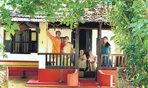 A.SANESH./Santhosh Thanikad with his family at Thani Illam