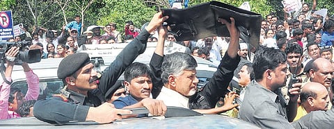 YSRC workers stage a sit-in before TDP chief N Chandrababu Naidu at Visakhapatnam airport on Thursday | G Satyanarayana